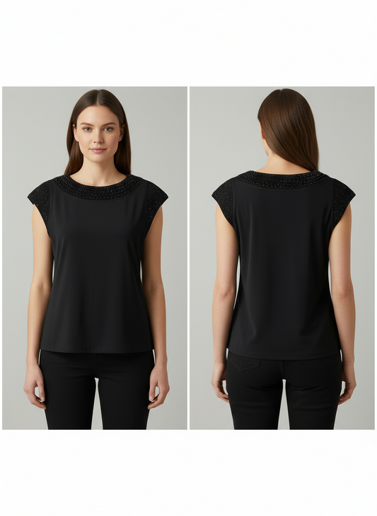 Black sleeveless top worn by a model on a gray background